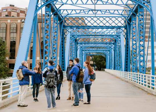 Students being educated on the Blue Bridge.